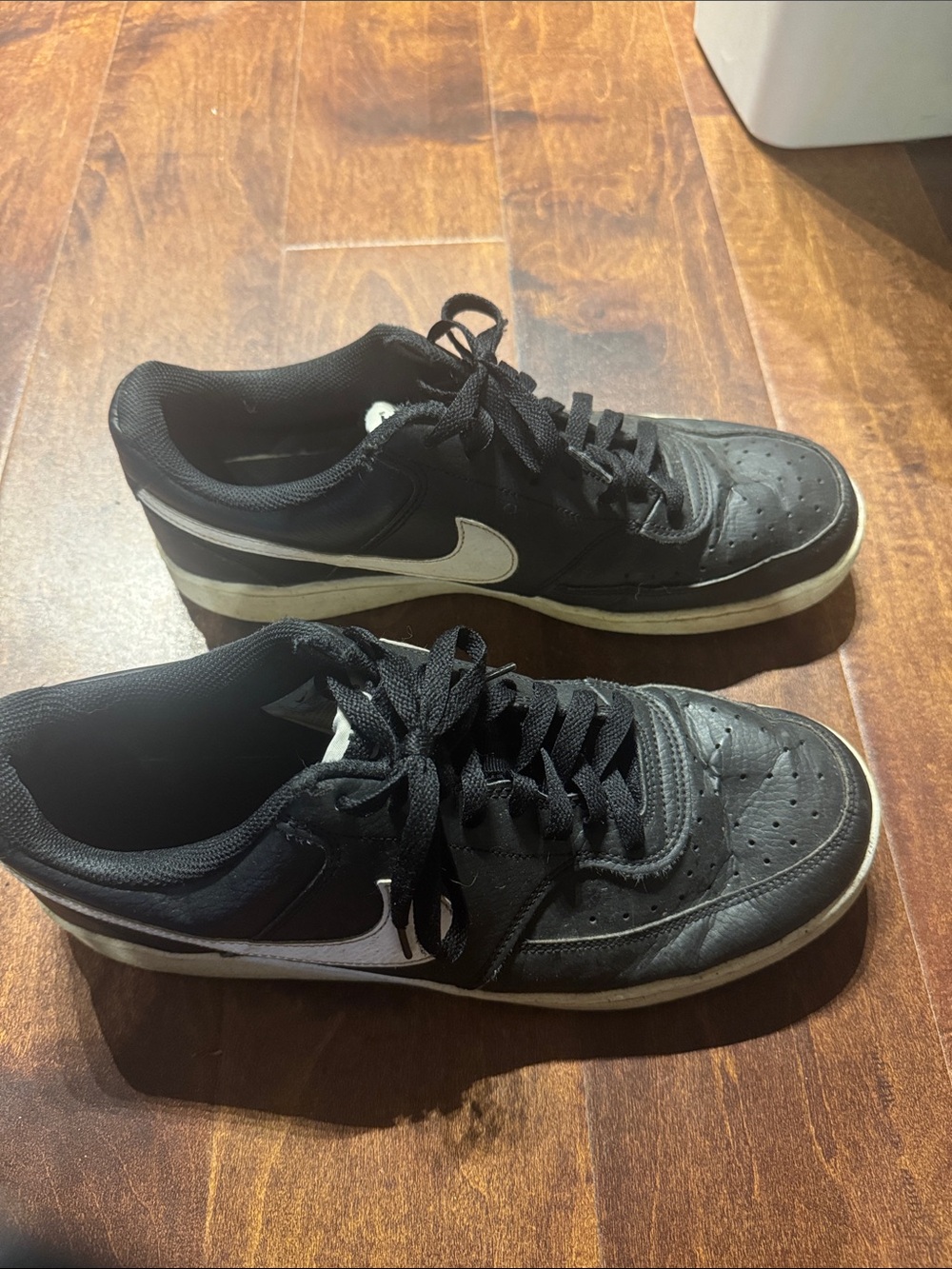 Nike Black Low-Top Sneakers with White Swoosh